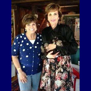 Kitty Dukakis (on right) picking up her
Brown & Tan Parti-coloured
Cockapoo puppy from Carol (on left).